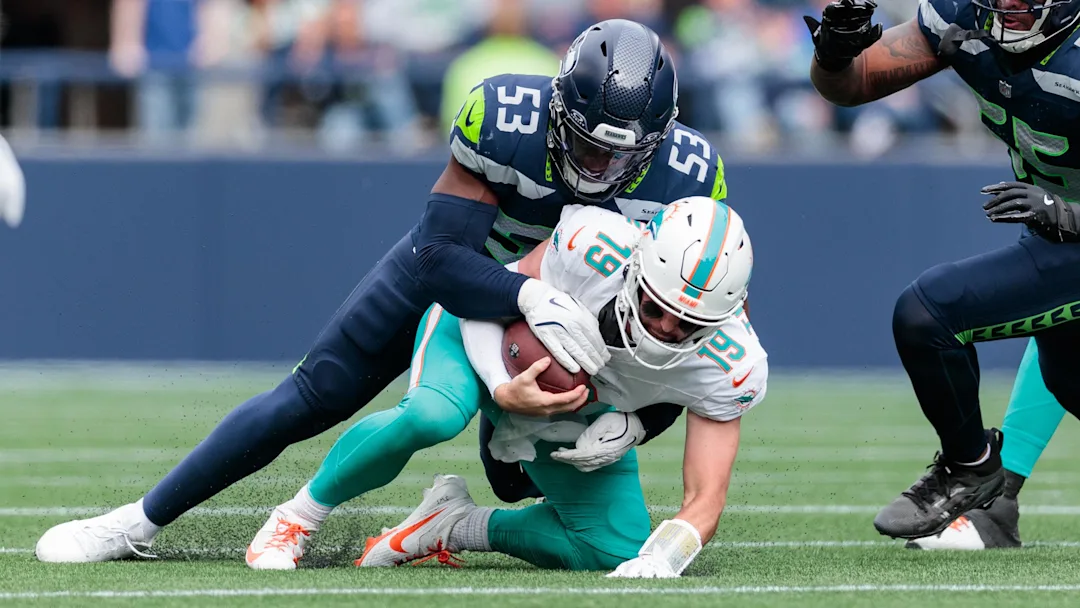 Skylar Thompson, Dolphins QB, being sacked by Seattle Seahawks defender