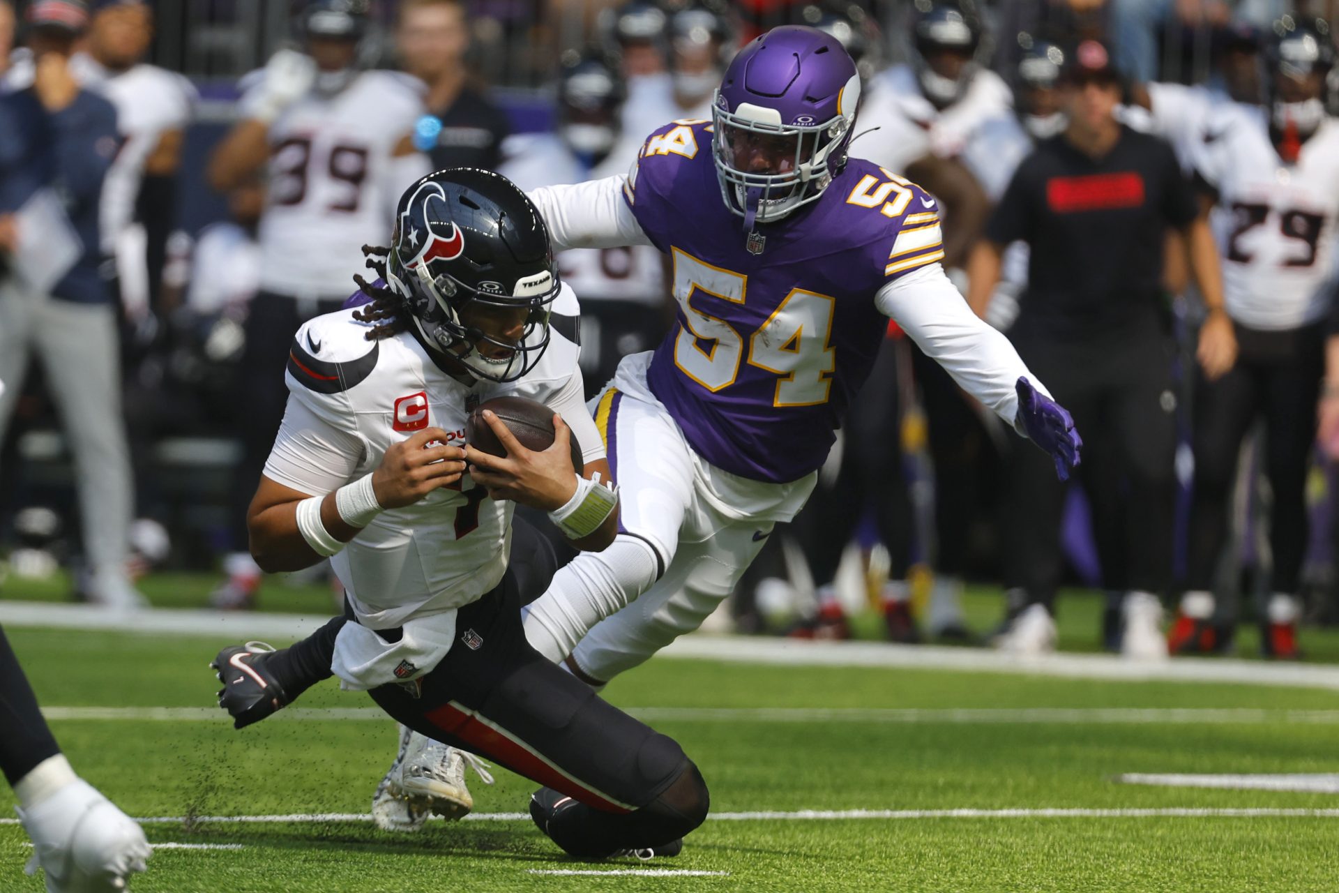 C.J. Stroud being tackled by Vikings defender