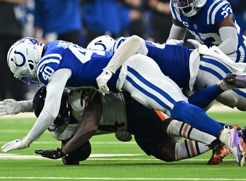 D'Andre Swift, Chicago Bears running back, being tackled by multiple Colts defensive players