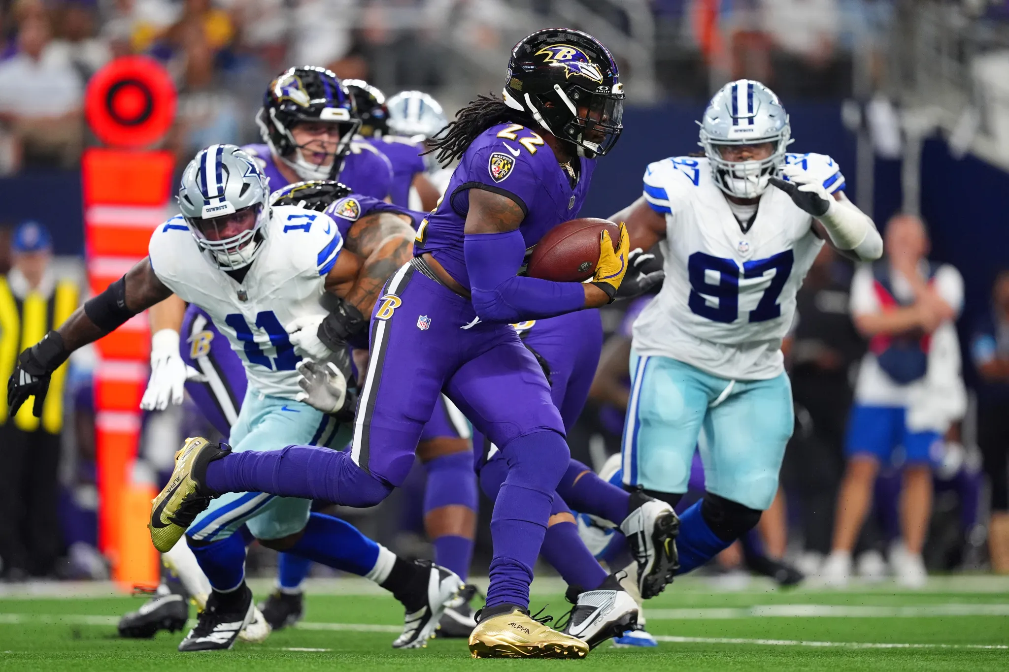 Derrick Henry, Ravens running back, carrying a football