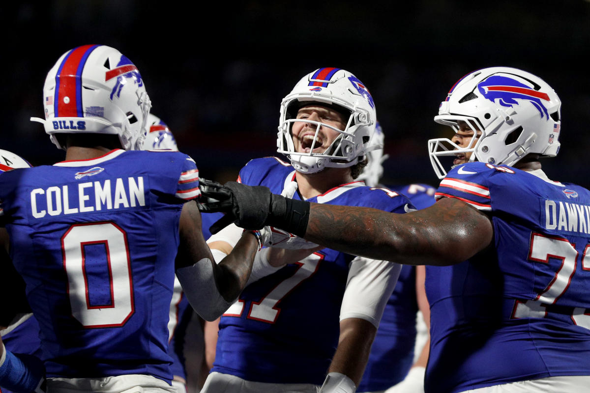 a group of football players celebrating